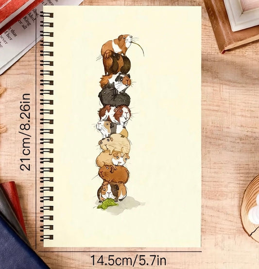 Guinea pig themed notebook, all 9 piled up