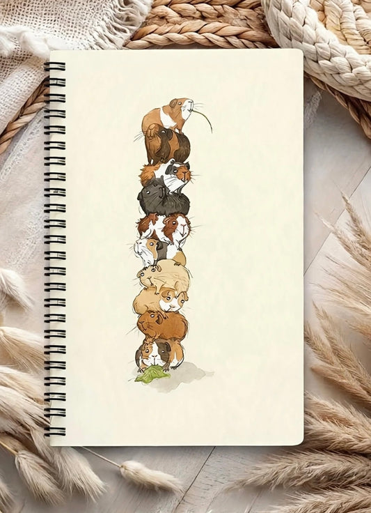 Guinea pig themed notebook, all 9 piled up